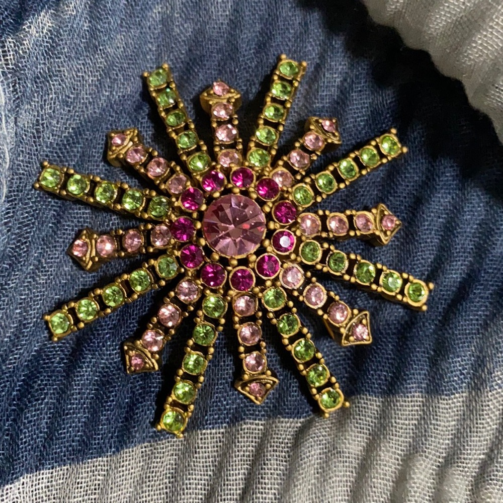 Express Star burst brooch in pink, green and fuchsia stones set.